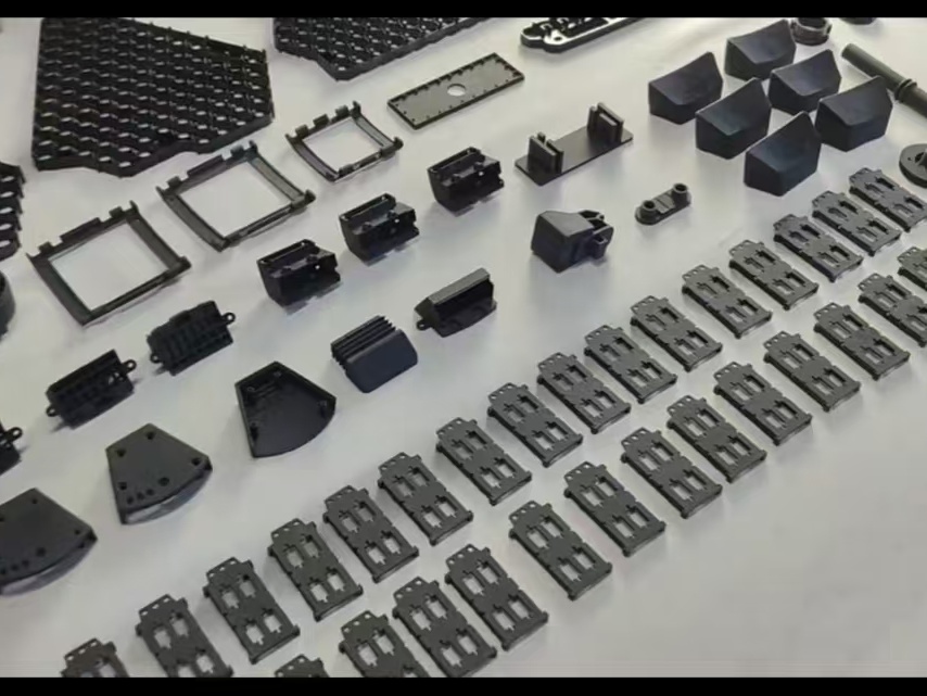 Small black prototype components produced via vacuum casting