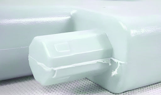 flash defects in injection molded plastic part along the mold parting line