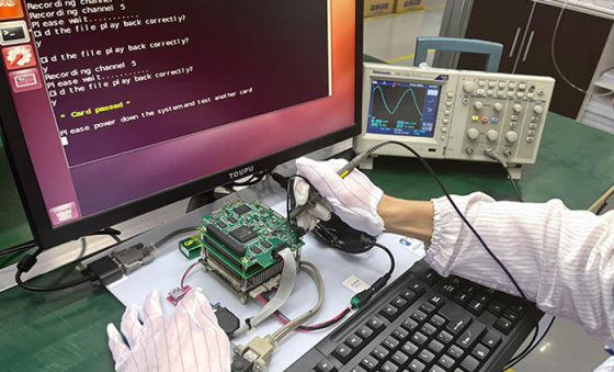 functional testing in electronics manufacturing PCB workstation with oscilloscope