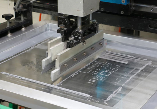Solder paste printing process on PCB using stencil and squeegee